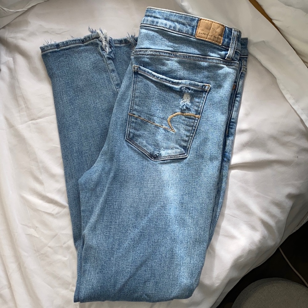 AE, high rise jeggings, distressed knees and side split bottoms, light wash